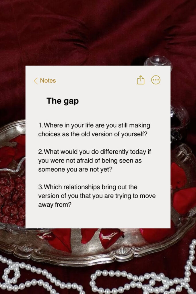 Self-reflection journaling prompts titled The gap displayed over a flat lay of rose petals, a silver tray, and a pearl necklace on dark burgundy velvet.