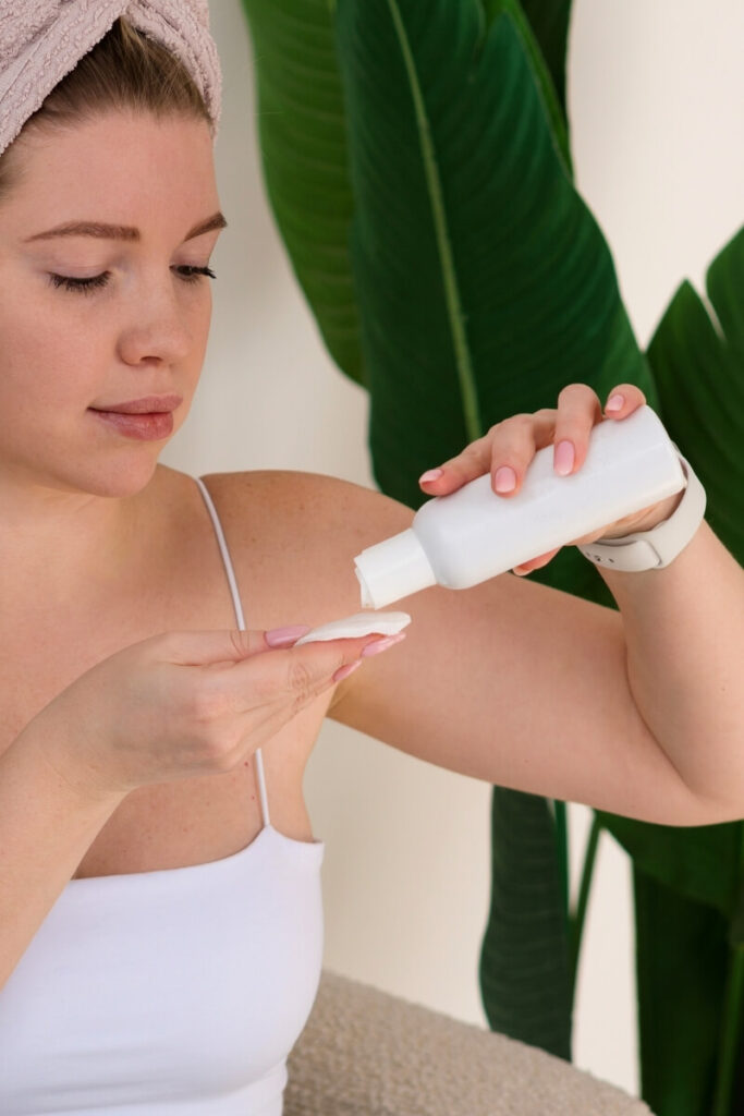 Woman pressing hydrating toner into her skin with her palms during a Korean skincare morning routine for glass skin