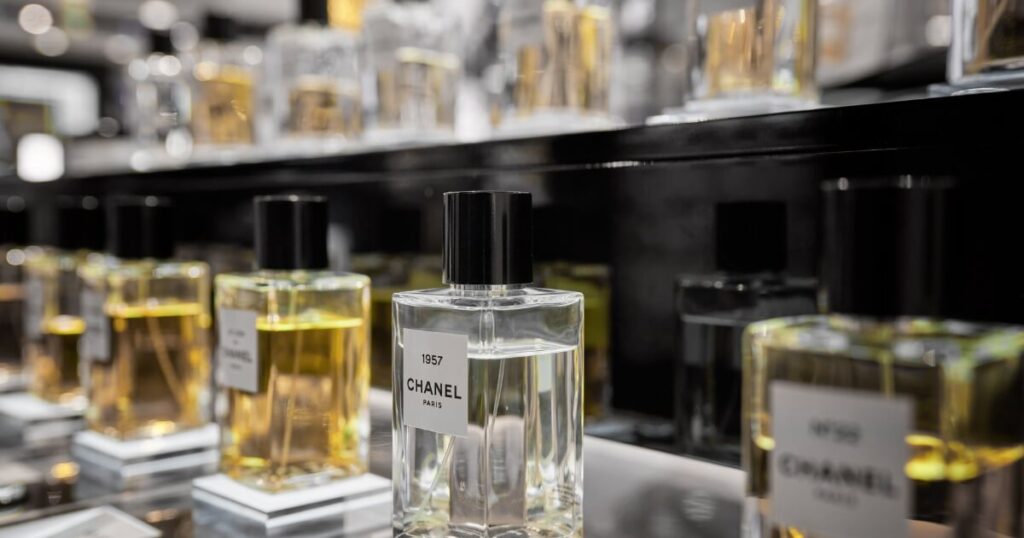 Different scents stacked on a shelf.