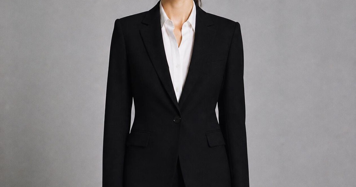 Carolyn Bessette Calvin Klein era black blazer and trouser studio look