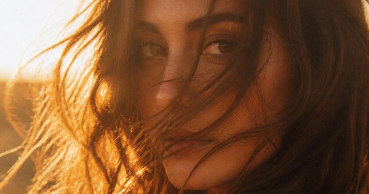 Woman in golden hour light, soft feminine energy