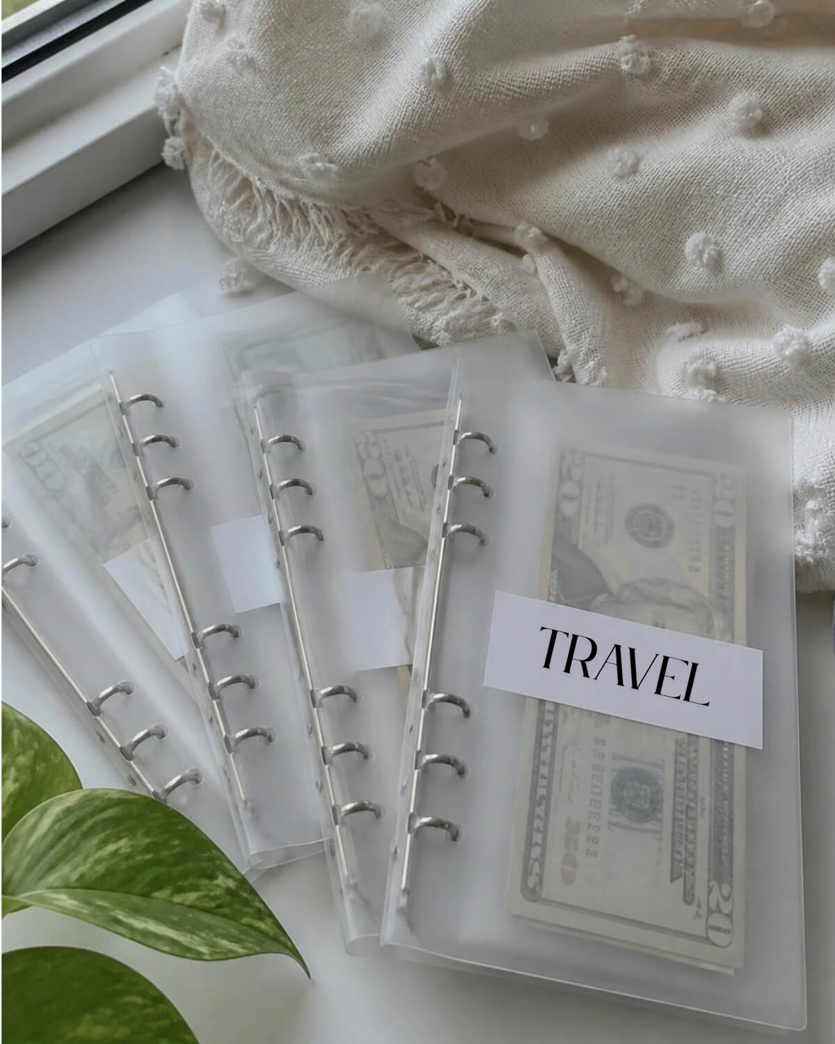 Cash budget envelopes with dollar bills sorted by category, a simple way to save money when you live paycheck to paycheck